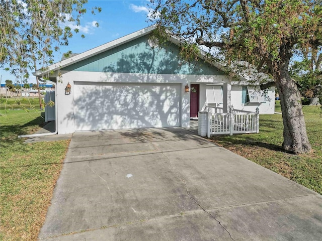 ranch-style house with a front yard, a garage, and covered porch