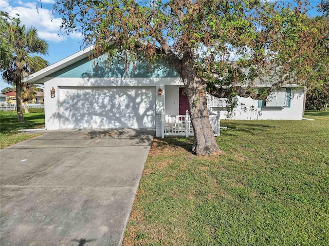 ranch-style home with a garage and a front lawn