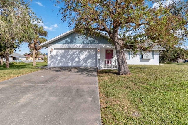 ranch-style home featuring a garage and a front lawn