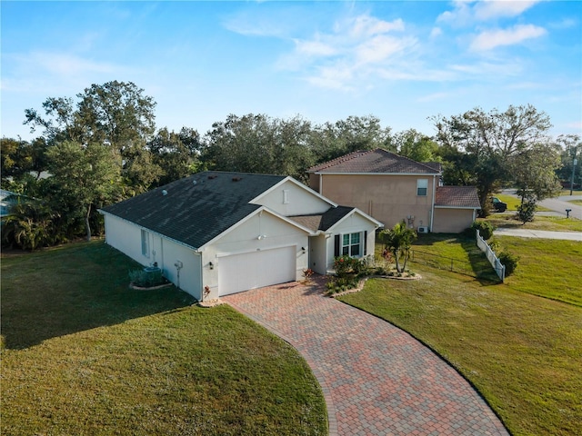 view of front of house featuring a garage and a front yard