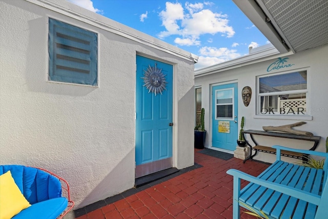 doorway to property with a patio