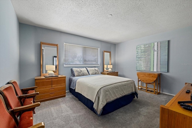 bedroom featuring carpet and a textured ceiling