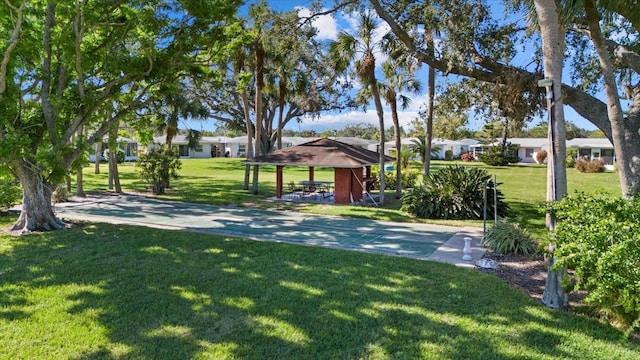 view of property's community featuring a lawn and a gazebo