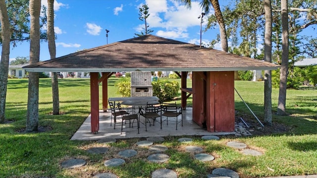 exterior space with a gazebo, a patio area, and a lawn