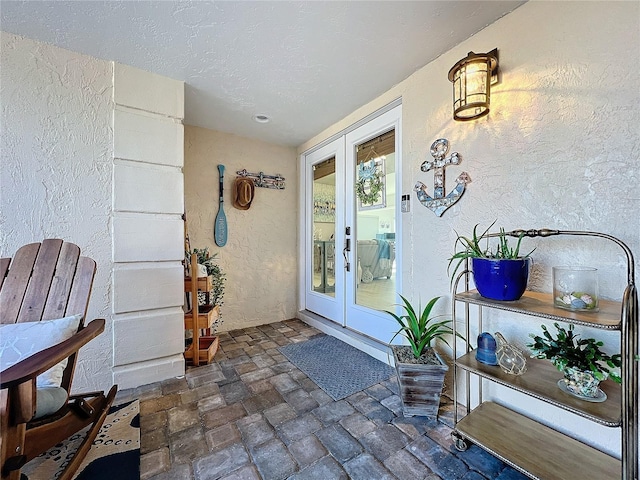 property entrance featuring french doors