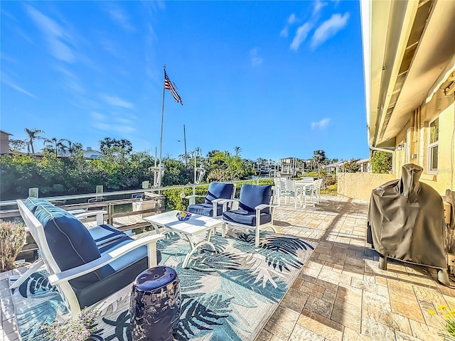 view of patio featuring a grill