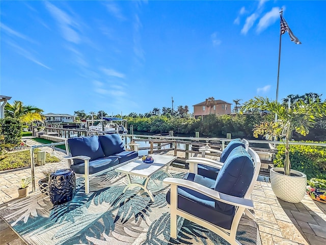 view of patio featuring a water view and an outdoor hangout area