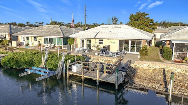 back of property with a water view