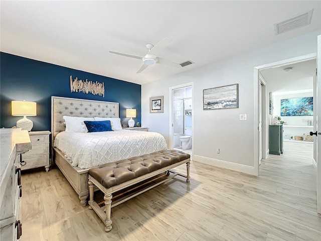 bedroom with ensuite bath, light hardwood / wood-style flooring, and ceiling fan