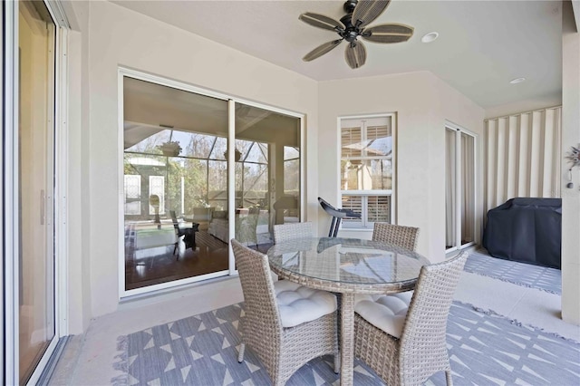 sunroom / solarium with ceiling fan