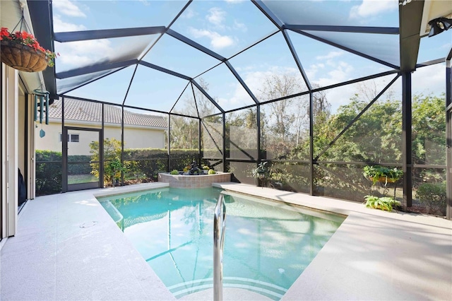 view of pool featuring a patio and a lanai