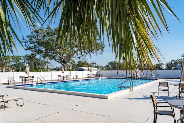 view of swimming pool with a patio area