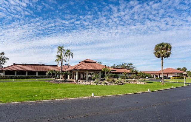 view of front facade featuring a gazebo and a front yard