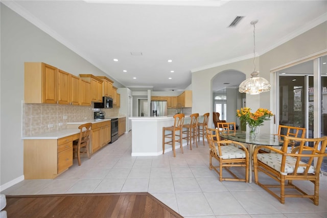 kitchen featuring light countertops, visible vents, backsplash, appliances with stainless steel finishes, and ornamental molding