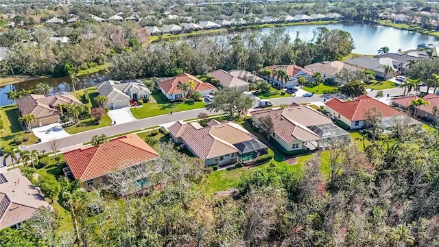 birds eye view of property with a residential view and a water view