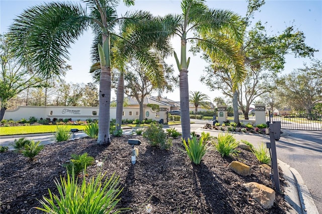 surrounding community featuring a gate and fence