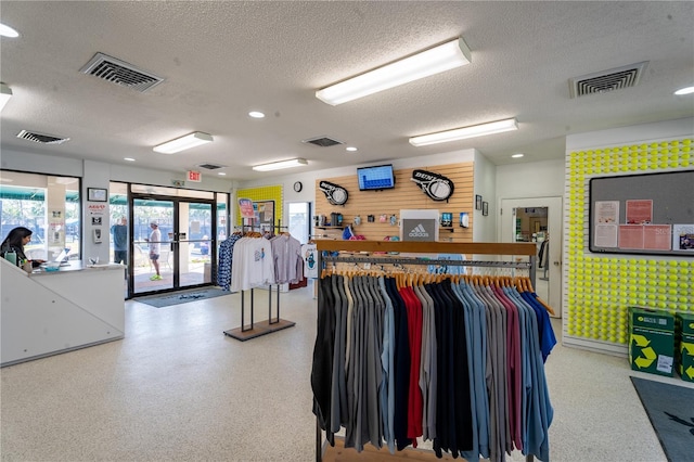 interior space featuring visible vents and speckled floor