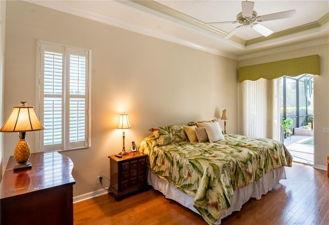 bedroom featuring access to exterior, multiple windows, and crown molding