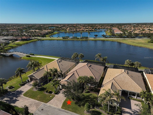 birds eye view of property with a water view