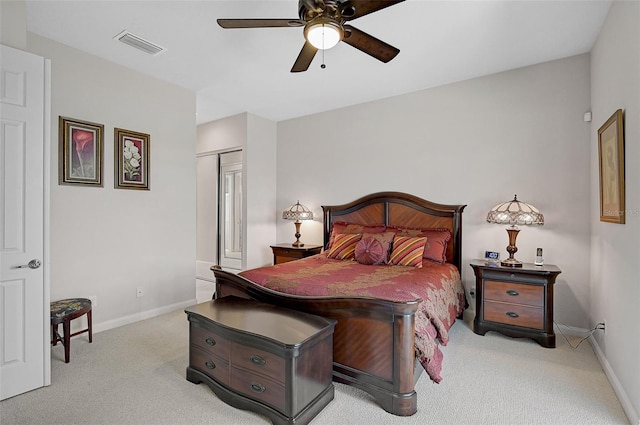 carpeted bedroom featuring a closet and ceiling fan