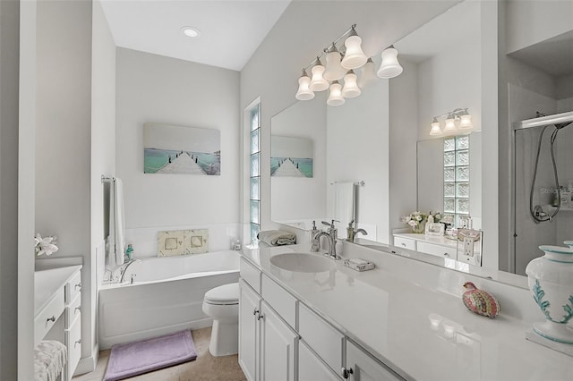 bathroom with a tub to relax in, tile patterned floors, vanity, and toilet