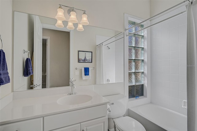 full bathroom with shower / tub combo, vanity, and toilet