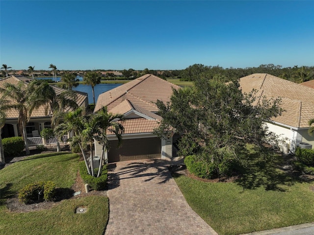 birds eye view of property with a water view