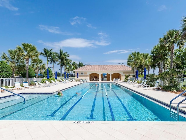 view of swimming pool featuring a patio area