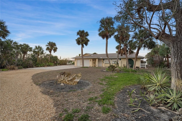 single story home featuring a garage