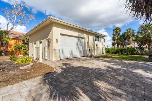 view of property exterior featuring a garage