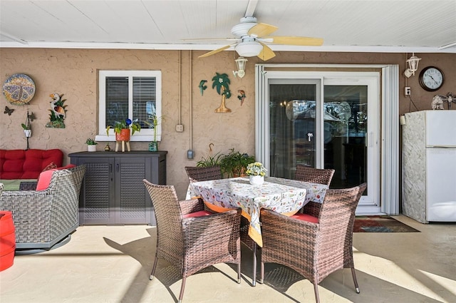 view of patio featuring ceiling fan