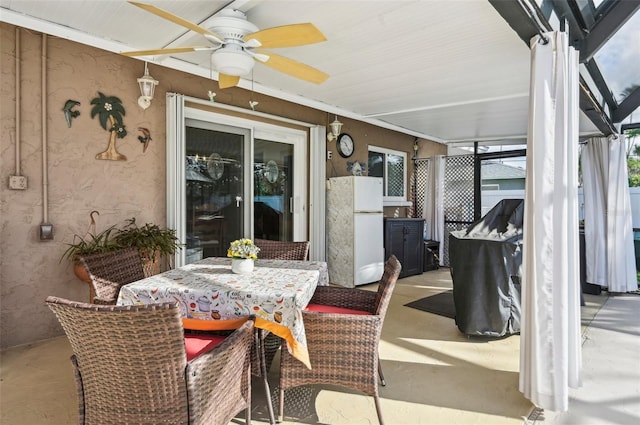 sunroom with ceiling fan and a healthy amount of sunlight