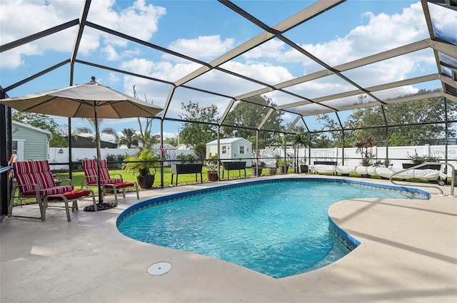 view of swimming pool featuring glass enclosure, a patio, and a storage unit