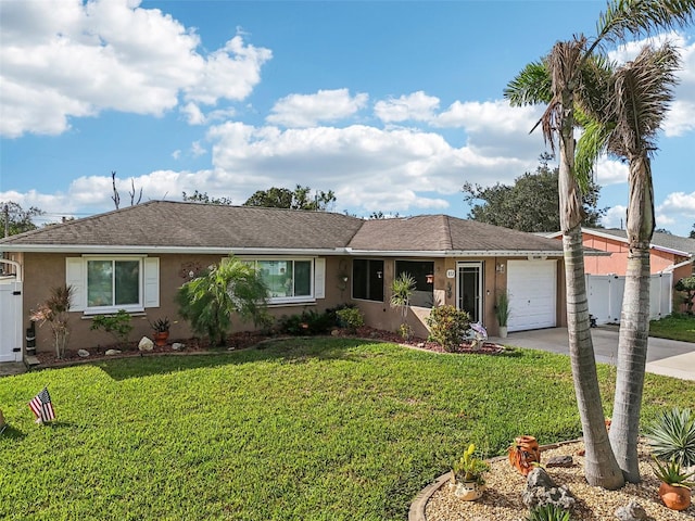 ranch-style home with a front yard and a garage