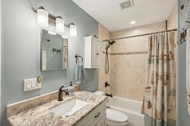 full bathroom featuring vanity, toilet, and shower / bathtub combination with curtain