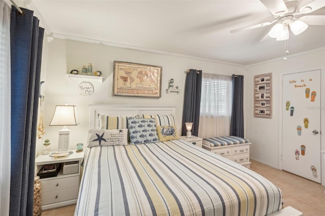 tiled bedroom featuring ceiling fan and crown molding