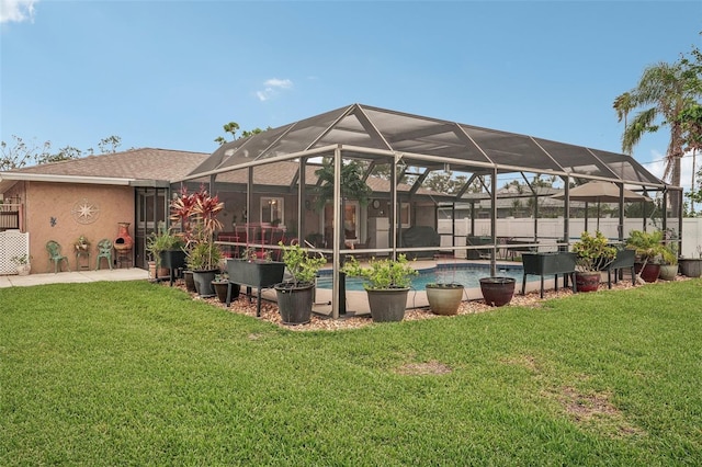 exterior space with a lanai and a fenced in pool