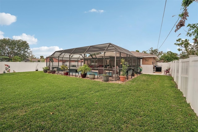 view of yard with a lanai and a swimming pool