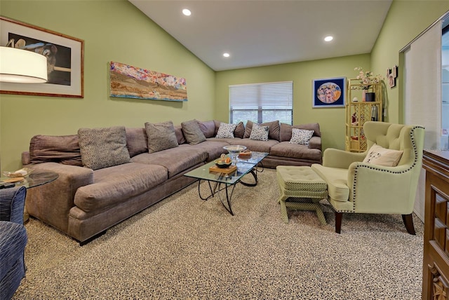 carpeted living room with vaulted ceiling