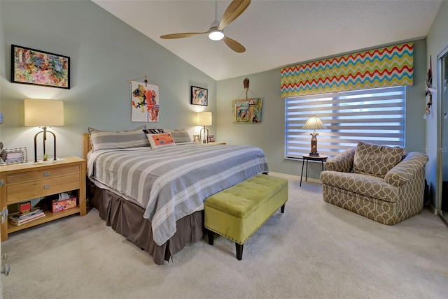 carpeted bedroom featuring ceiling fan, baseboards, and vaulted ceiling