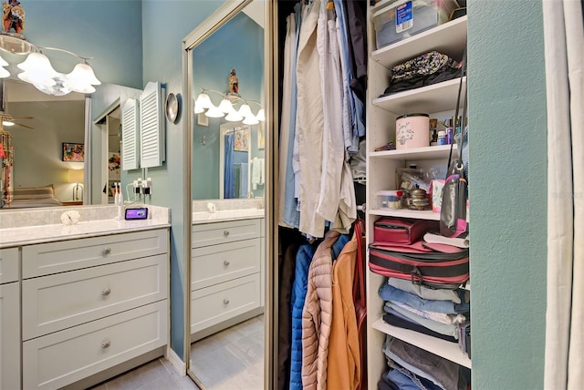 bathroom featuring tile patterned floors, vanity, and ceiling fan