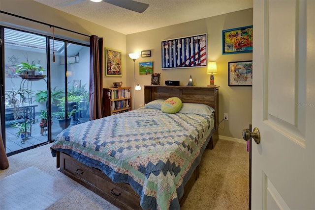 carpeted bedroom featuring access to exterior, ceiling fan, a textured ceiling, and baseboards