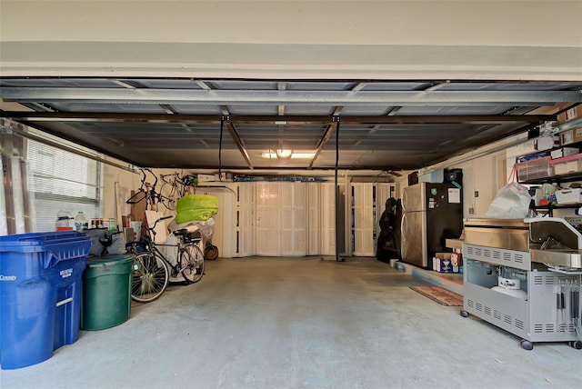 garage with stainless steel fridge