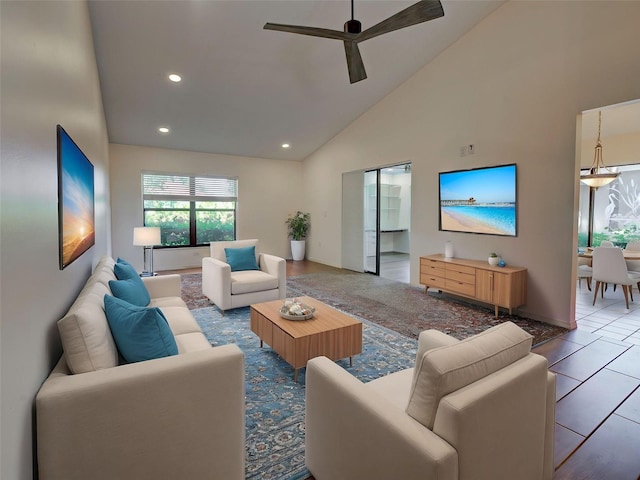 tiled living area featuring ceiling fan, recessed lighting, and high vaulted ceiling