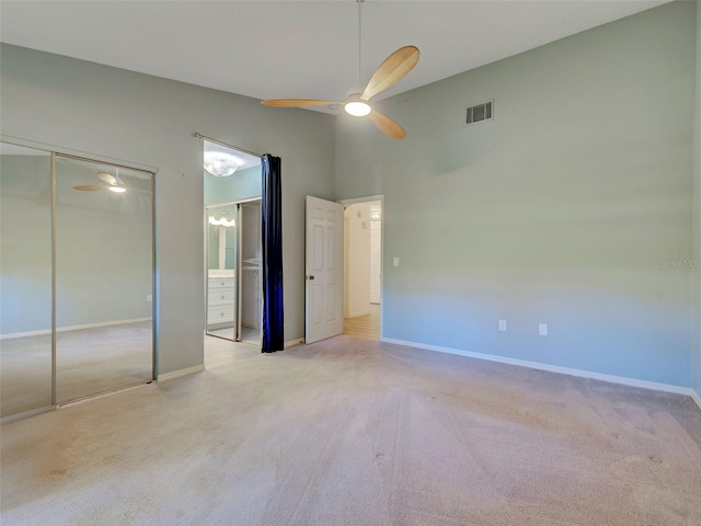 unfurnished bedroom featuring baseboards, visible vents, and carpet flooring