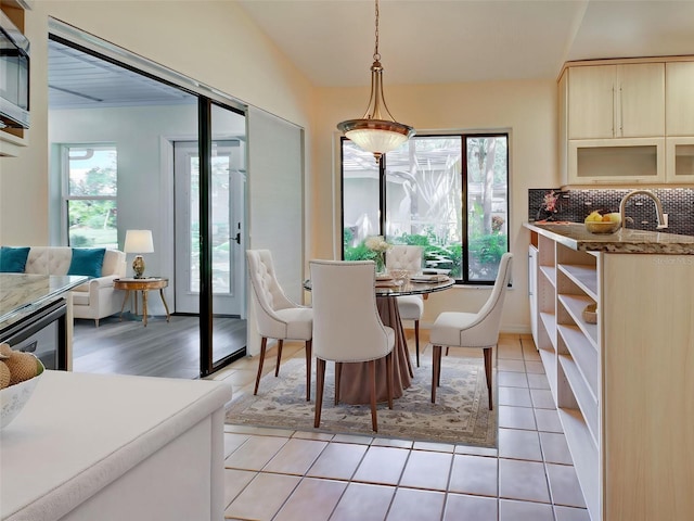 dining area with light tile patterned floors