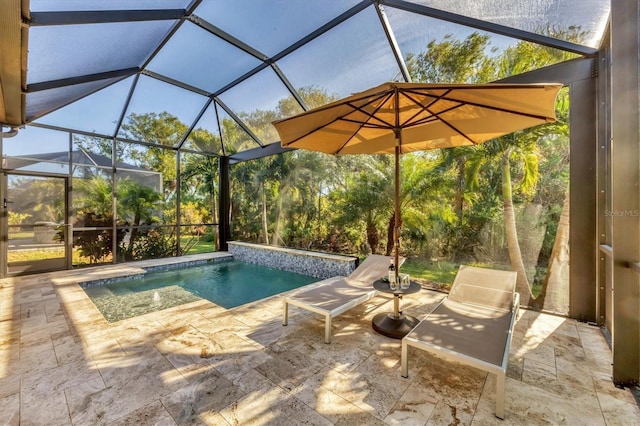 view of swimming pool featuring a lanai and a patio area