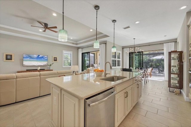 kitchen with a kitchen island with sink, dishwasher, plenty of natural light, and sink