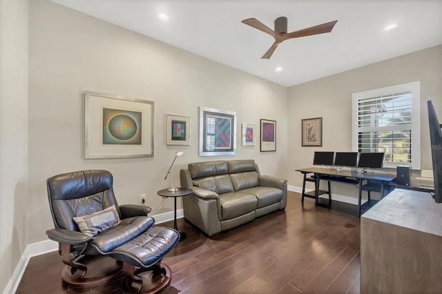 living room featuring dark hardwood / wood-style flooring and ceiling fan