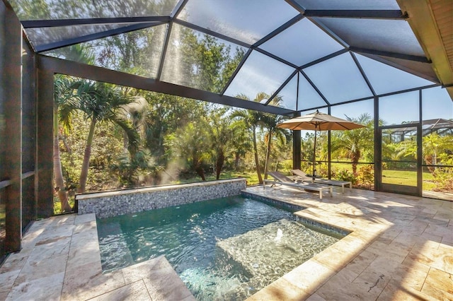 view of swimming pool with a patio, pool water feature, and a lanai